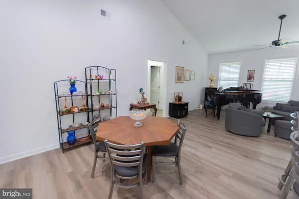 a dining room with furniture and window