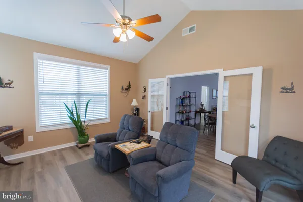 a living room with furniture and a window
