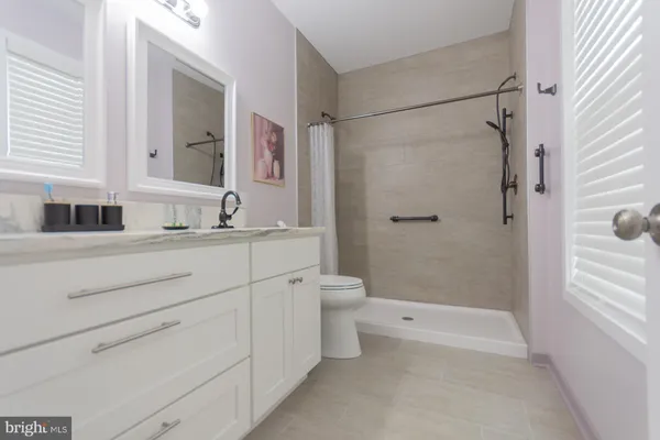 a bathroom with a shower and a toilet