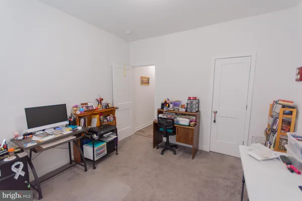 a workspace with furniture and window