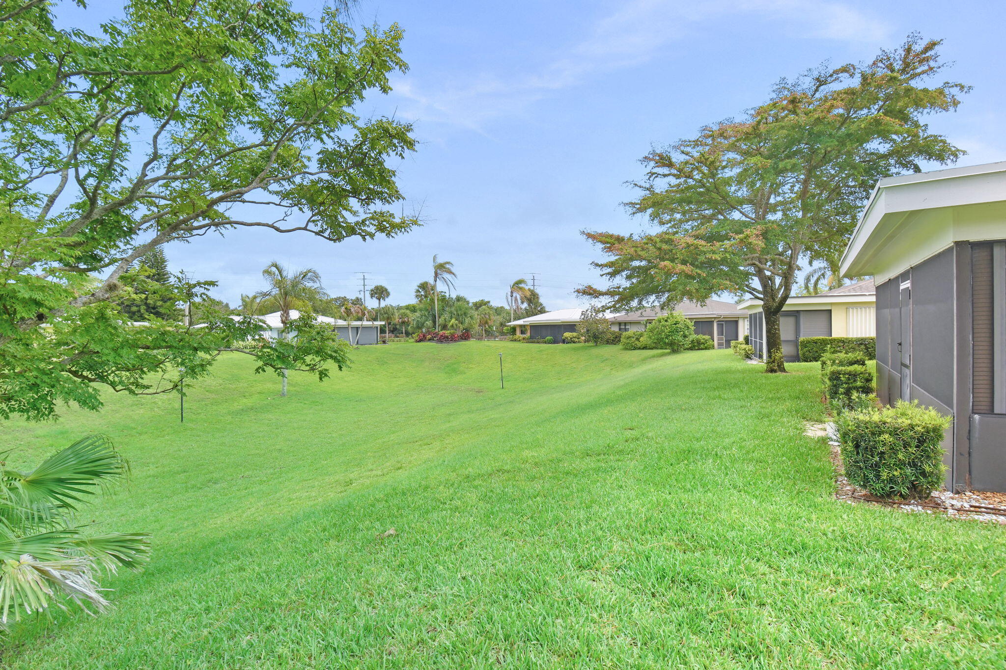 5251 Southeast Sea Island Way Stuart, FL 34997 - Photo 35 of 68 a view of a garden with a tree