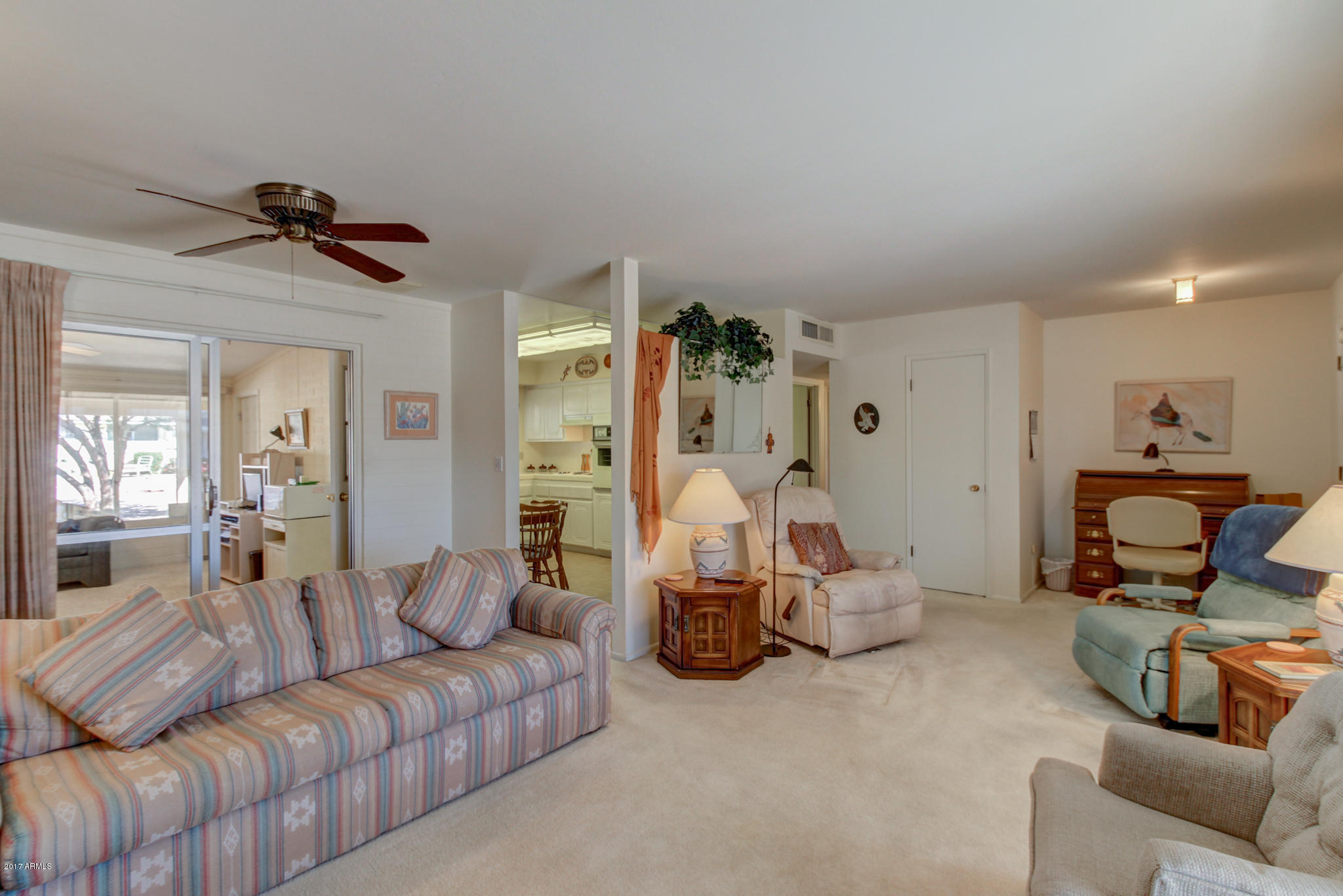 10008 West Riviera Drive Sun City, AZ 85351 - Photo 2 of 26 a living room with furniture