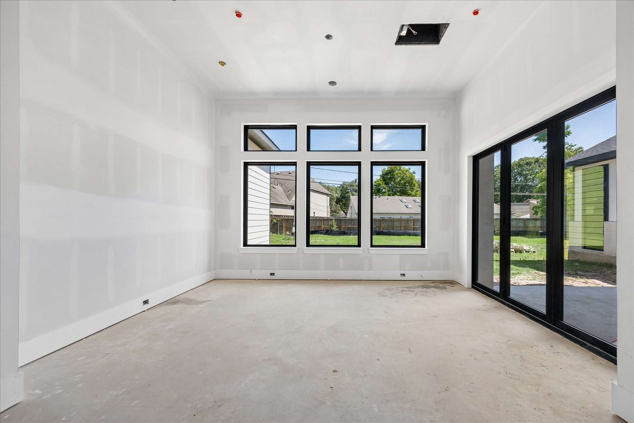 9050 Elizabeth Road Houston, TX 77055 - Photo 13 of 40 a view of an empty room with a window