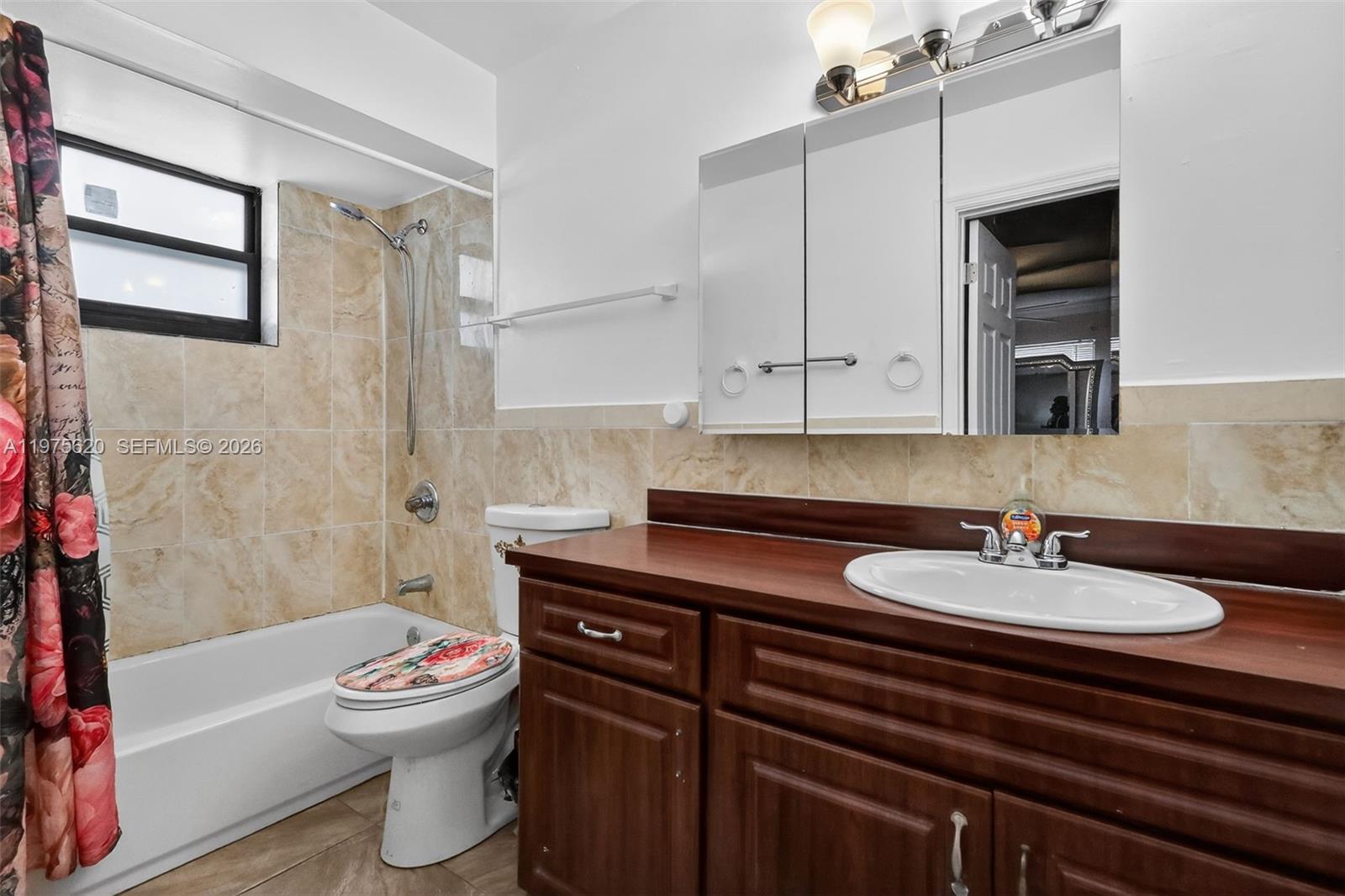 834 Northwest 115th Street Miami, FL 33168 - Photo 16 of 46 a bathroom with a sink toilet and shower