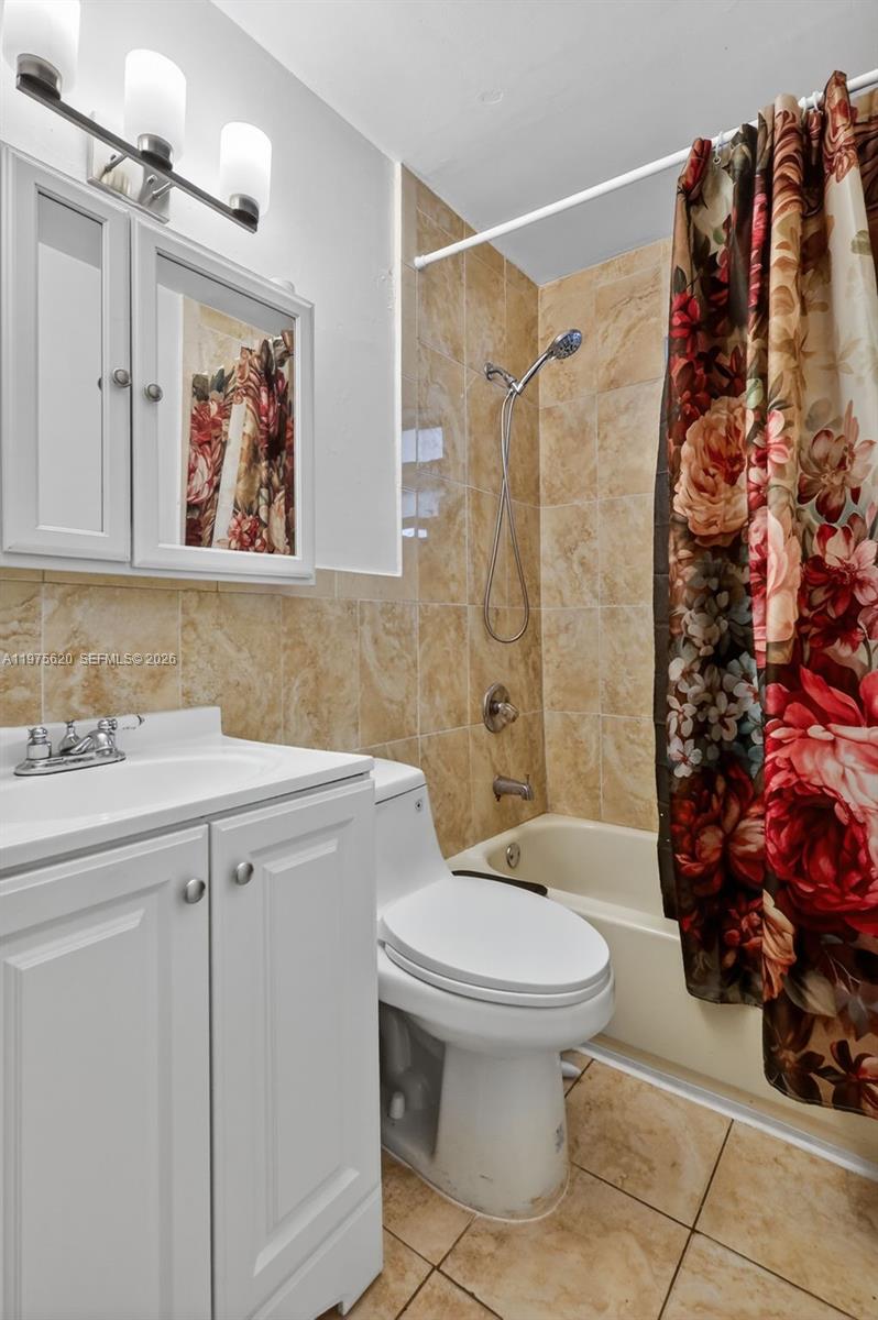 834 Northwest 115th Street Miami, FL 33168 - Photo 20 of 46 a bathroom with a sink toilet and shower