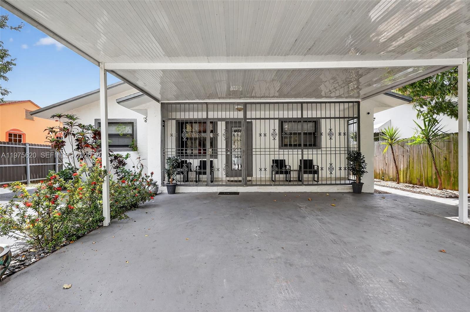 834 Northwest 115th Street Miami, FL 33168 - Photo 2 of 46 a view of a room with gym equipment