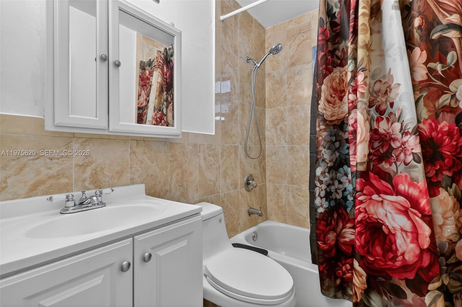 834 Northwest 115th Street Miami, FL 33168 - Photo 21 of 46 a bathroom with a sink toilet and shower
