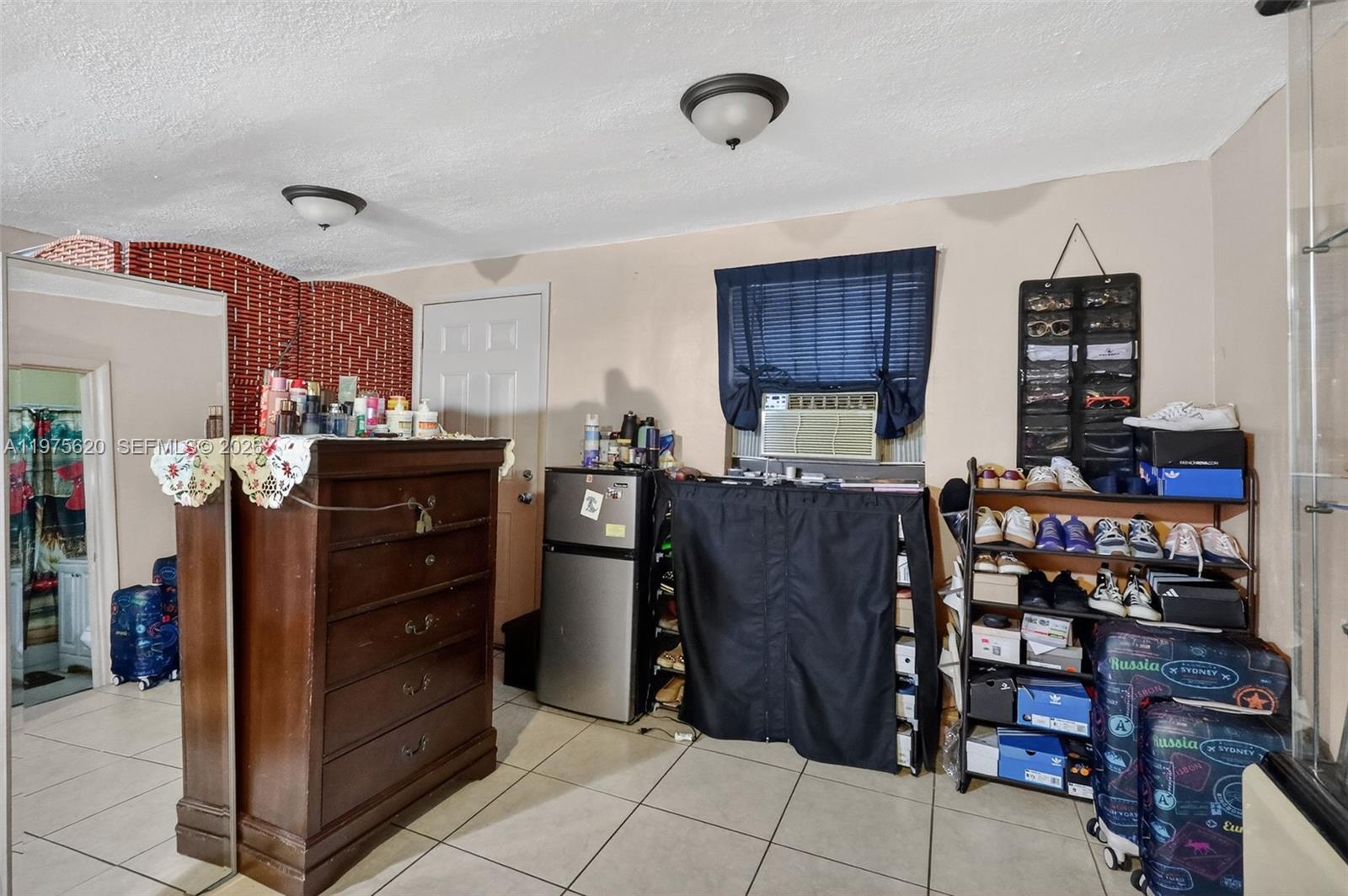 834 Northwest 115th Street Miami, FL 33168 - Photo 31 of 46 a kitchen with stainless steel appliances granite countertop a refrigerator and cabinets