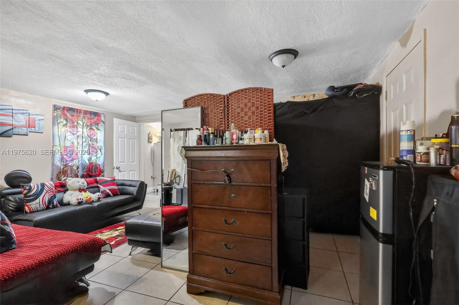 834 Northwest 115th Street Miami, FL 33168 - Photo 33 of 46 a bedroom with a bed and a window