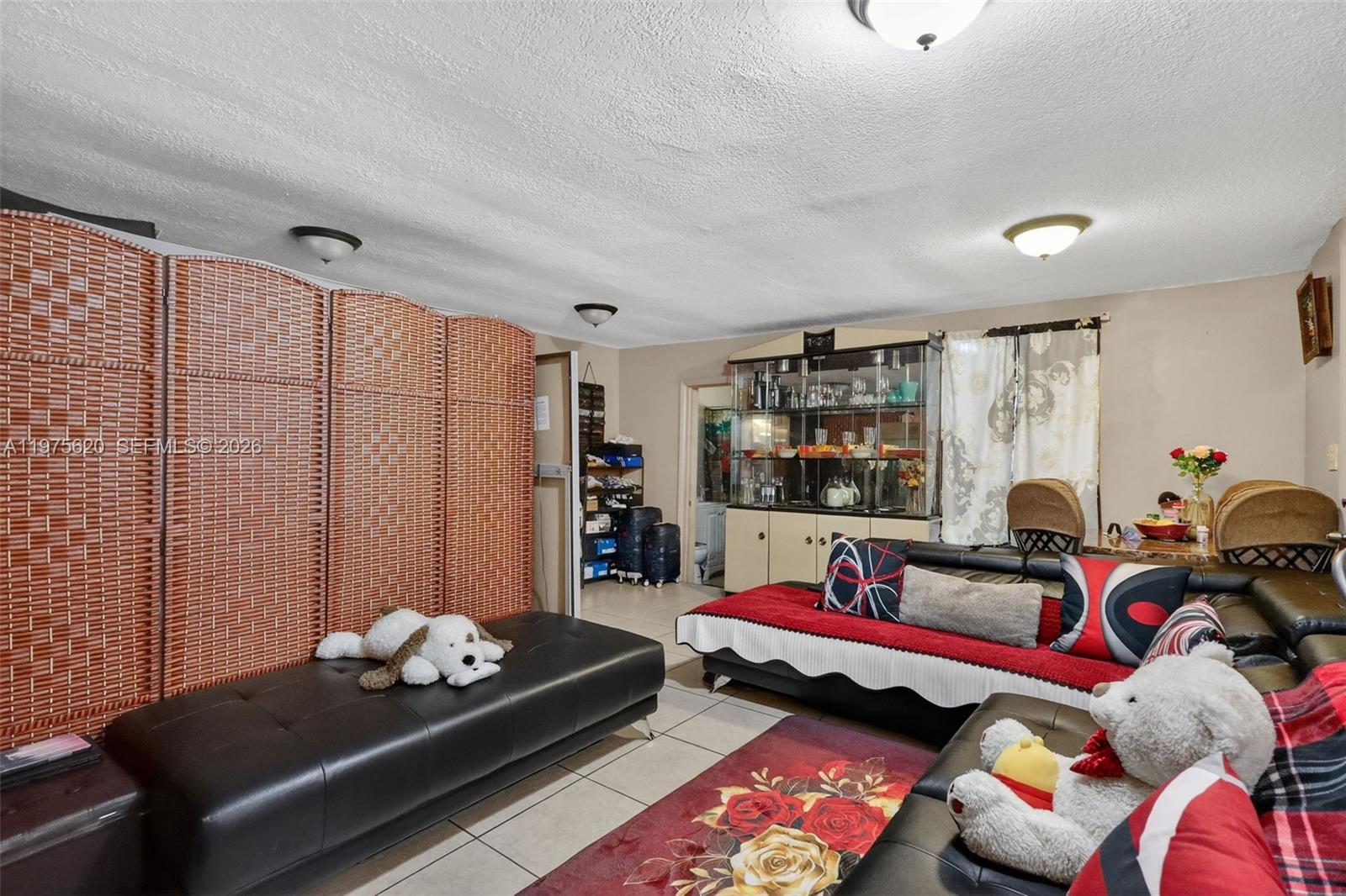 834 Northwest 115th Street Miami, FL 33168 - Photo 37 of 46 a living room with furniture and wooden floor