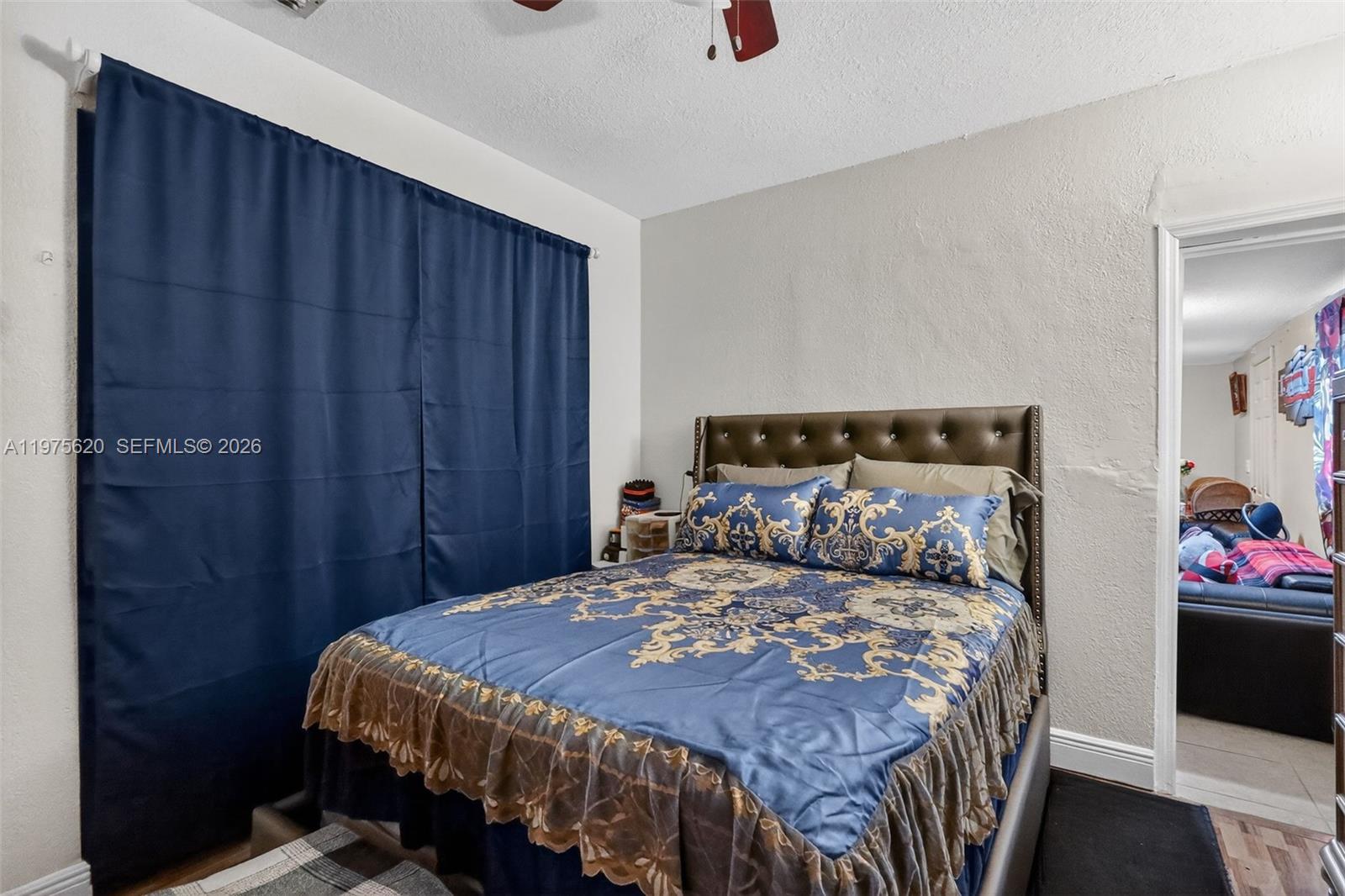 834 Northwest 115th Street Miami, FL 33168 - Photo 39 of 46 a bedroom with a bed and a closet