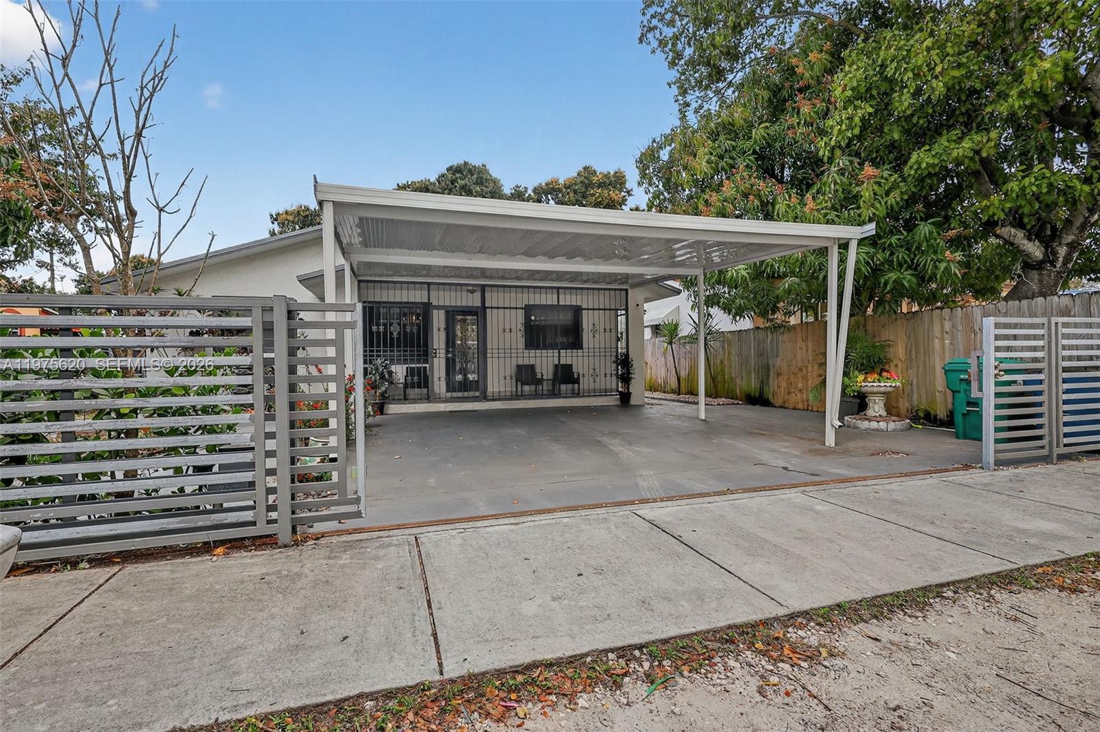 834 Northwest 115th Street Miami, FL 33168 - Photo 4 of 46 front view of a house with a garage