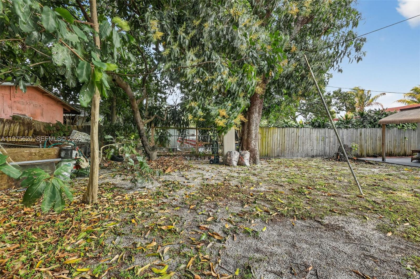 834 Northwest 115th Street Miami, FL 33168 - Photo 44 of 46 a backyard of a house with table and chairs