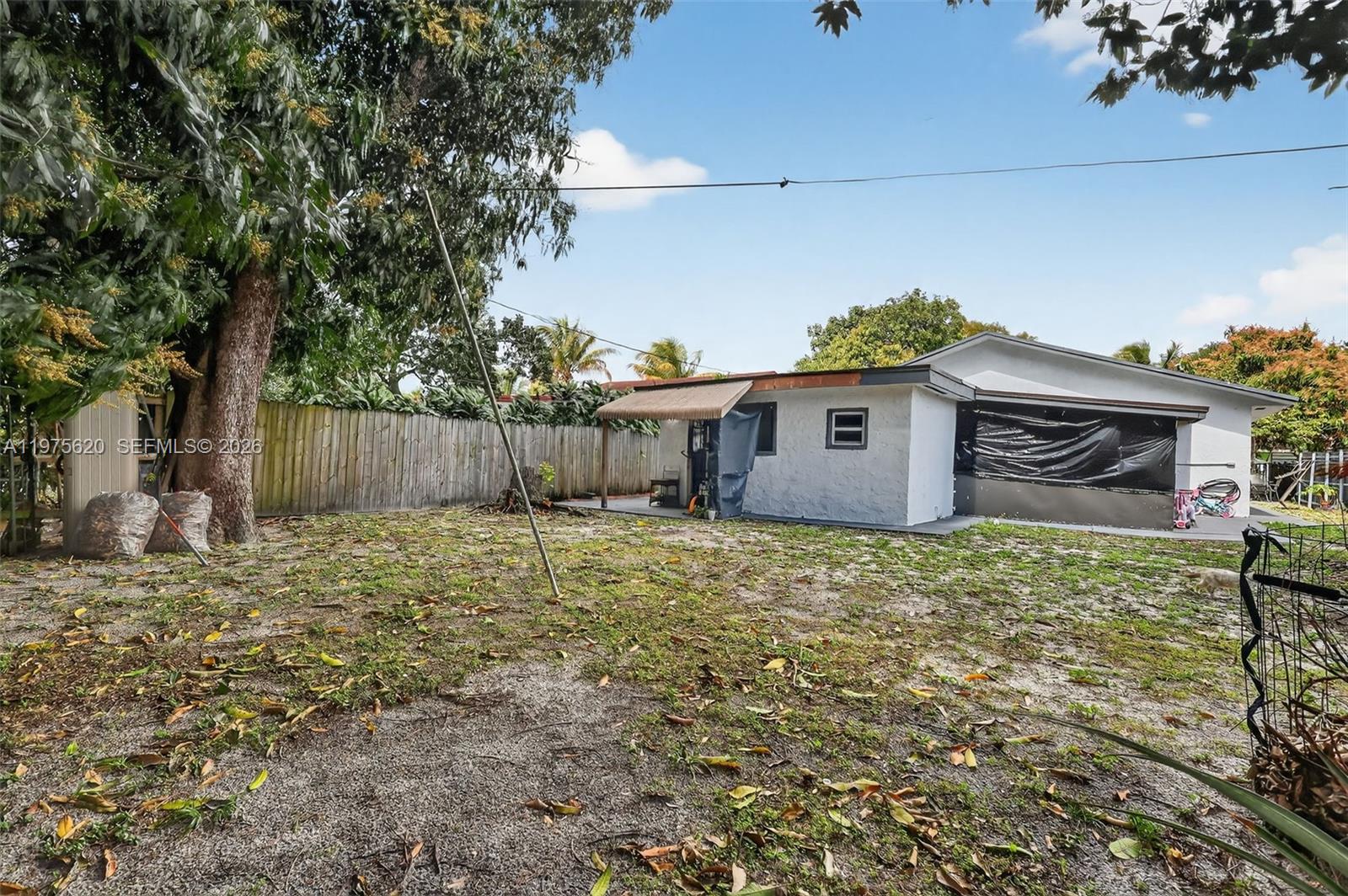 834 Northwest 115th Street Miami, FL 33168 - Photo 45 of 46 a backyard of a house