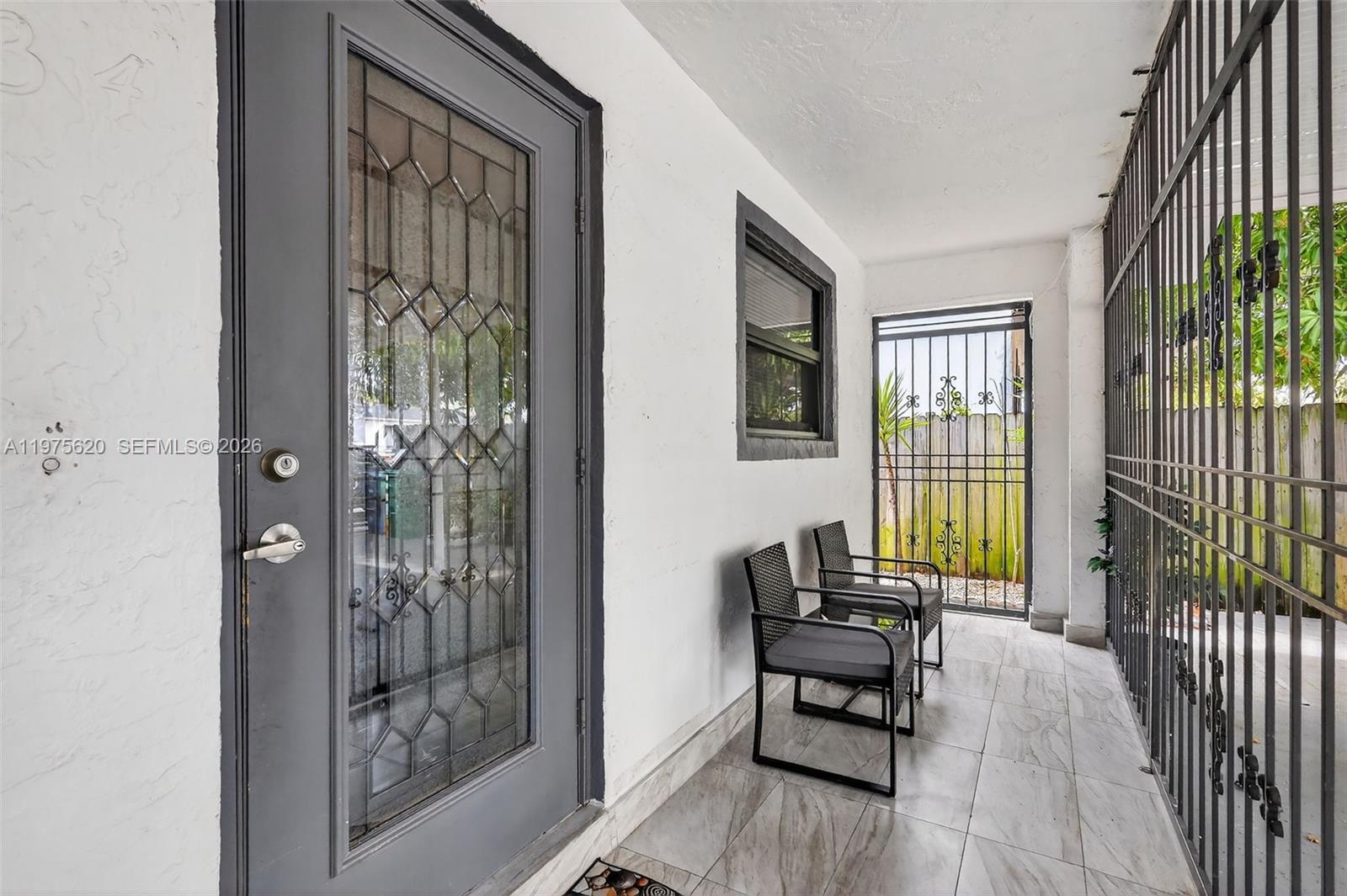 834 Northwest 115th Street Miami, FL 33168 - Photo 7 of 46 a living room with furniture and a window