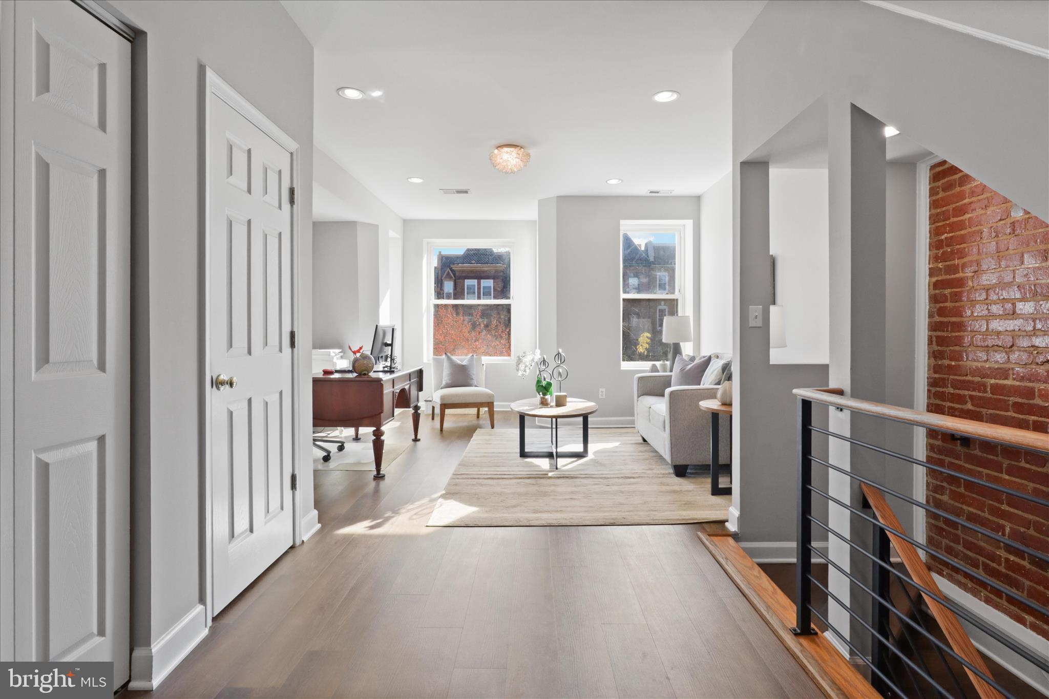 1327 Harvard Street Northwest Washington, DC 20009 - Photo 19 of 61 a living room with furniture and a large window