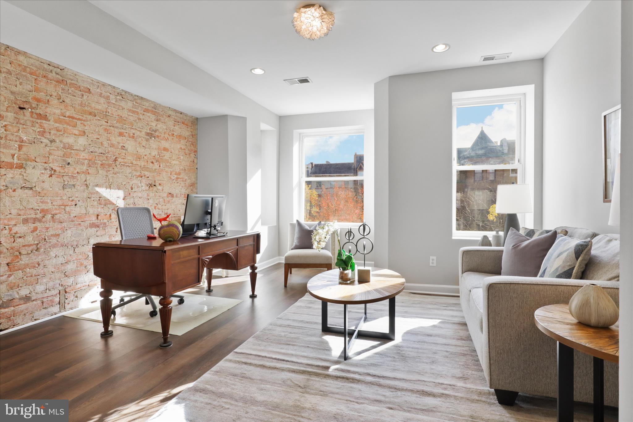1327 Harvard Street Northwest Washington, DC 20009 - Photo 20 of 61 a living room with furniture and a wooden floor