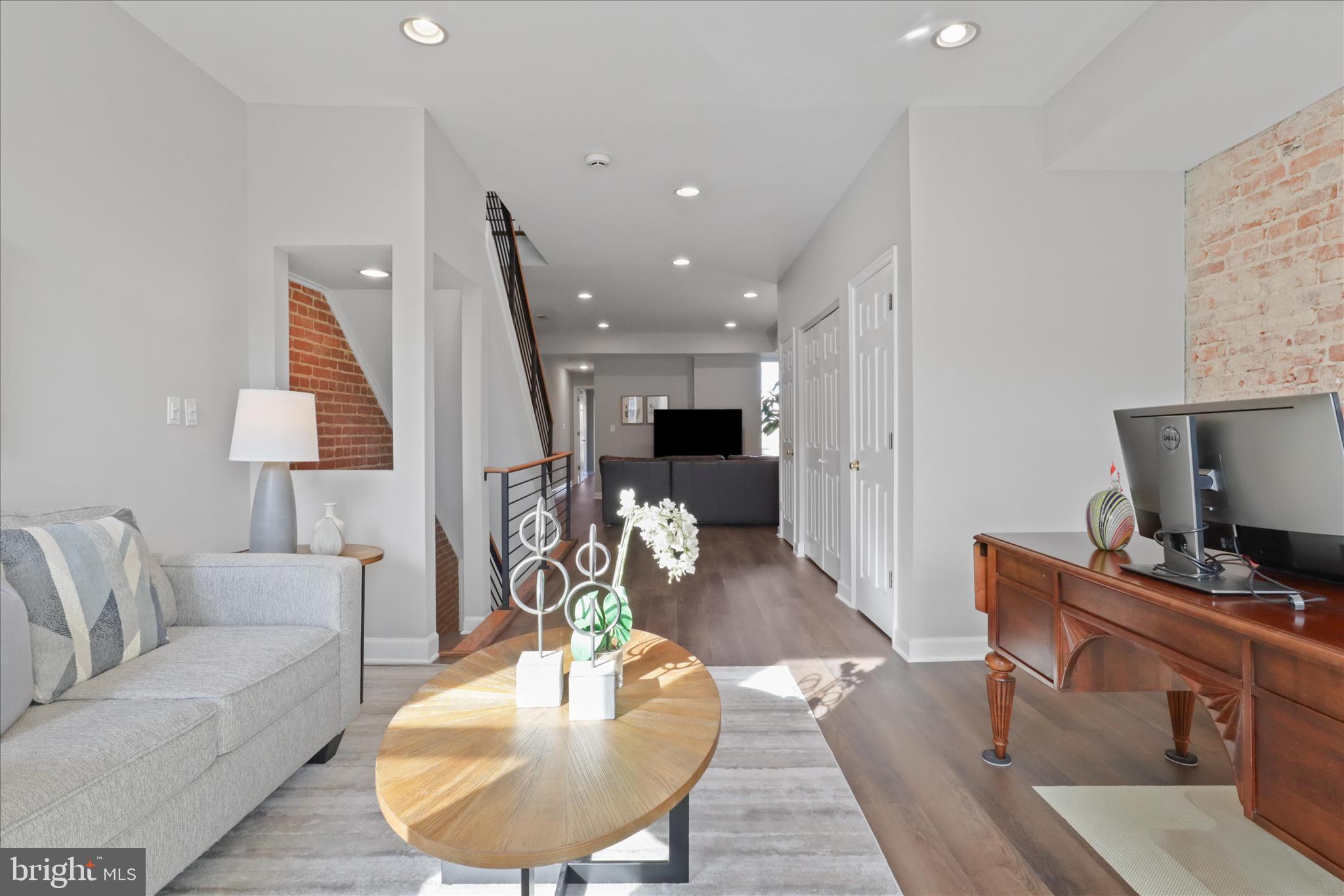 1327 Harvard Street Northwest Washington, DC 20009 - Photo 22 of 61 a living room with furniture and a wooden floor