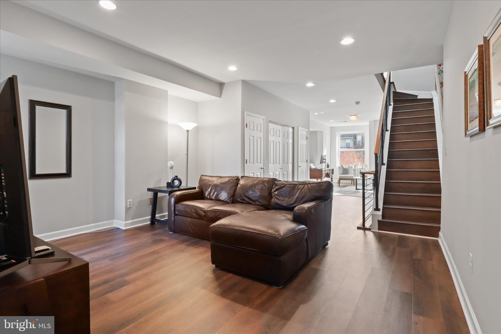 1327 Harvard Street Northwest Washington, DC 20009 - Photo 24 of 61 a living room with furniture and a wooden floor