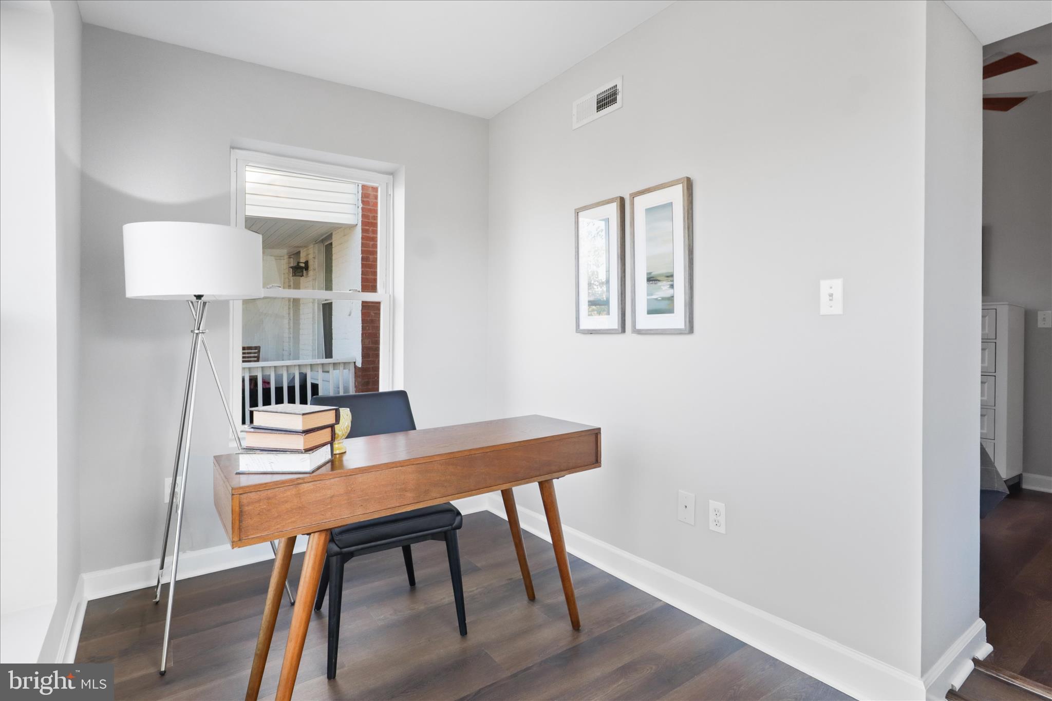 1327 Harvard Street Northwest Washington, DC 20009 - Photo 28 of 61 a view of a workspace with furniture and wooden floor