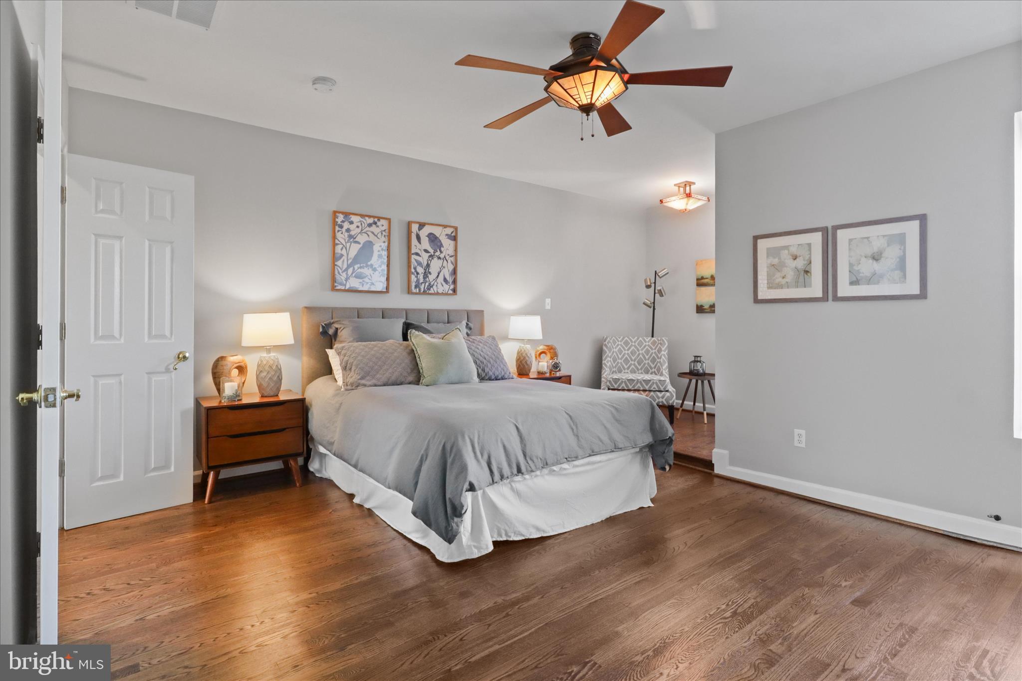 1327 Harvard Street Northwest Washington, DC 20009 - Photo 32 of 61 a bedroom with a bed and a chandelier
