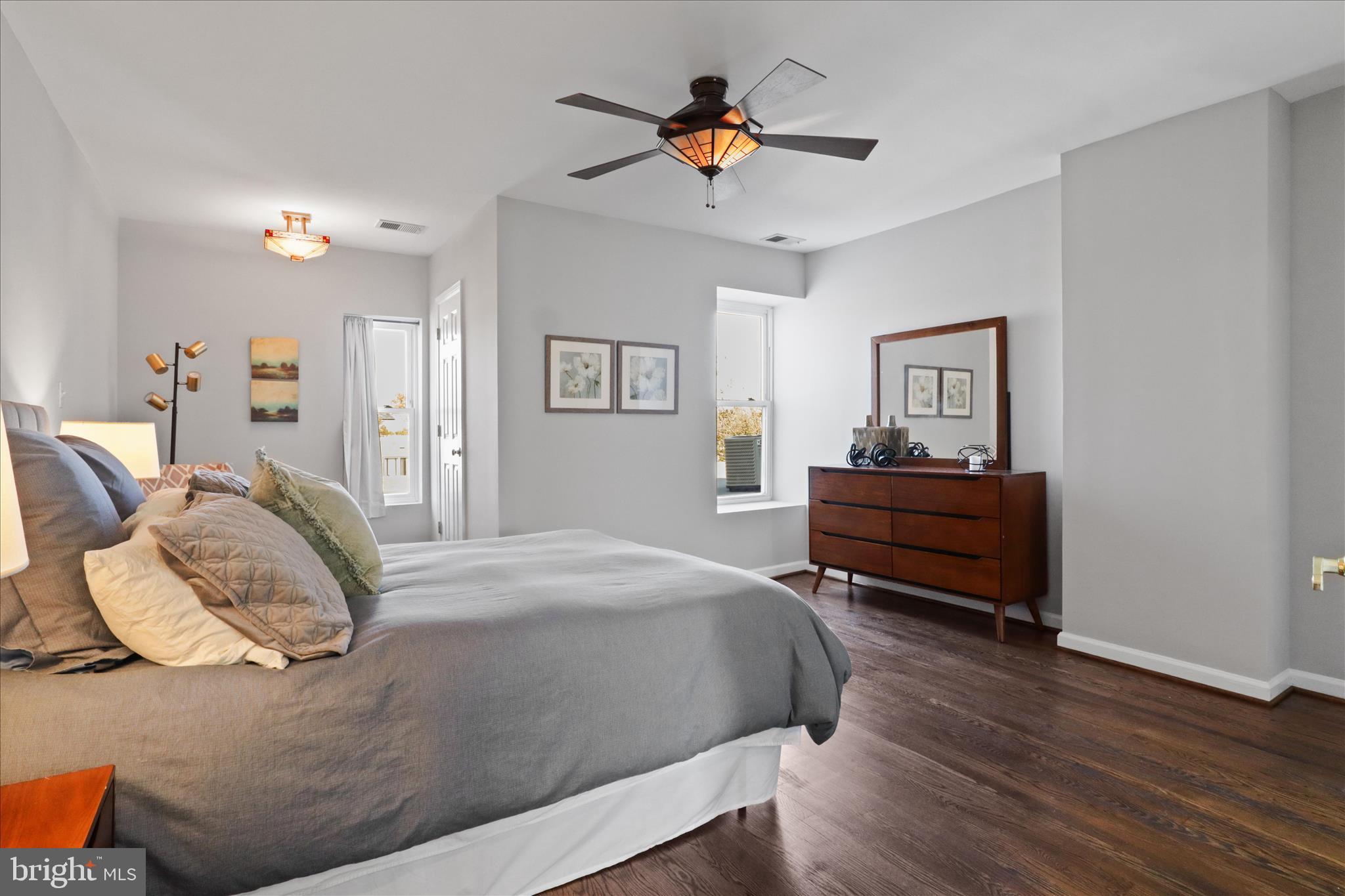 1327 Harvard Street Northwest Washington, DC 20009 - Photo 34 of 61 a bedroom with a bed and a chandelier