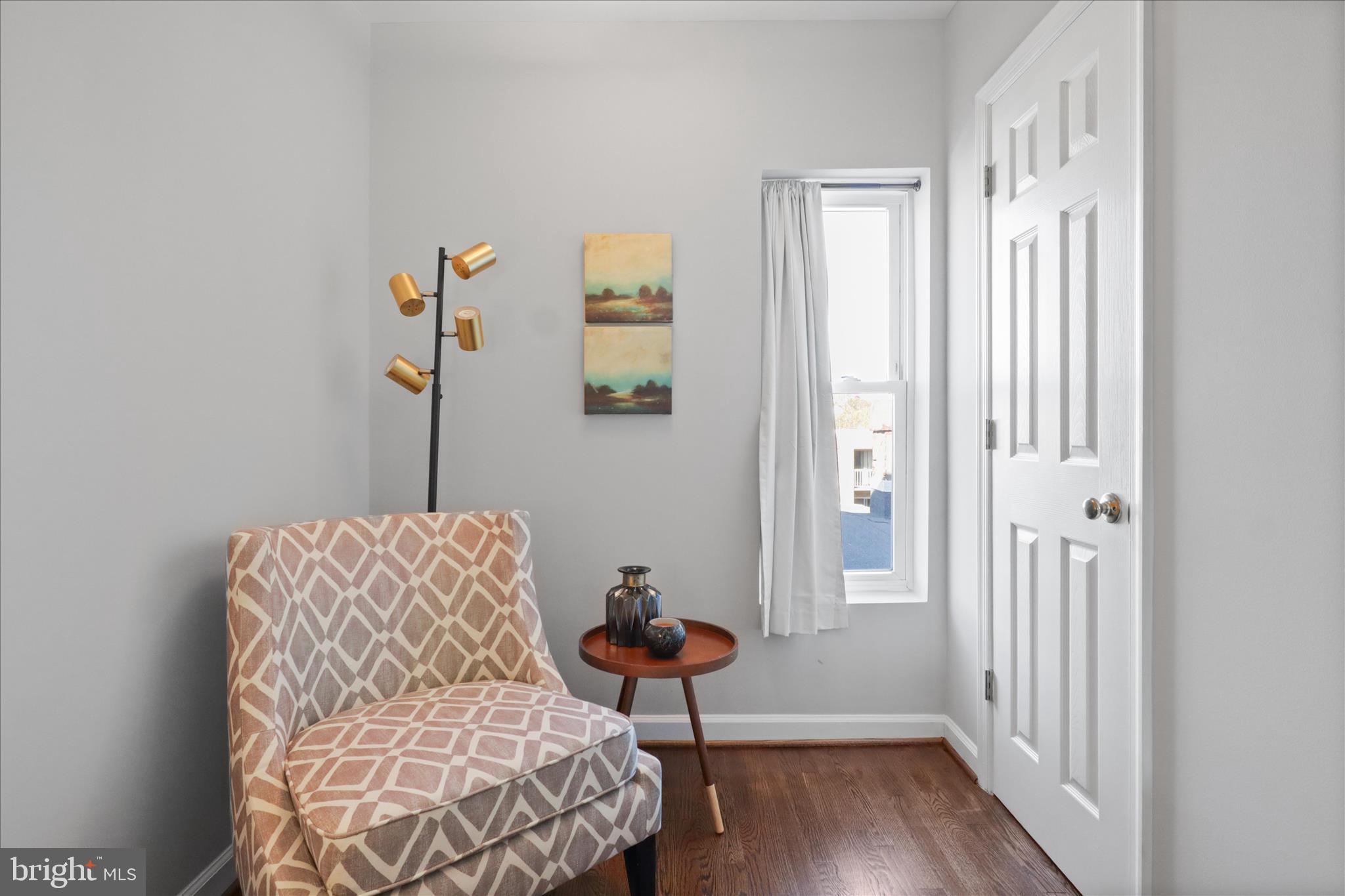 1327 Harvard Street Northwest Washington, DC 20009 - Photo 36 of 61 a bedroom with a bed and wooden floor