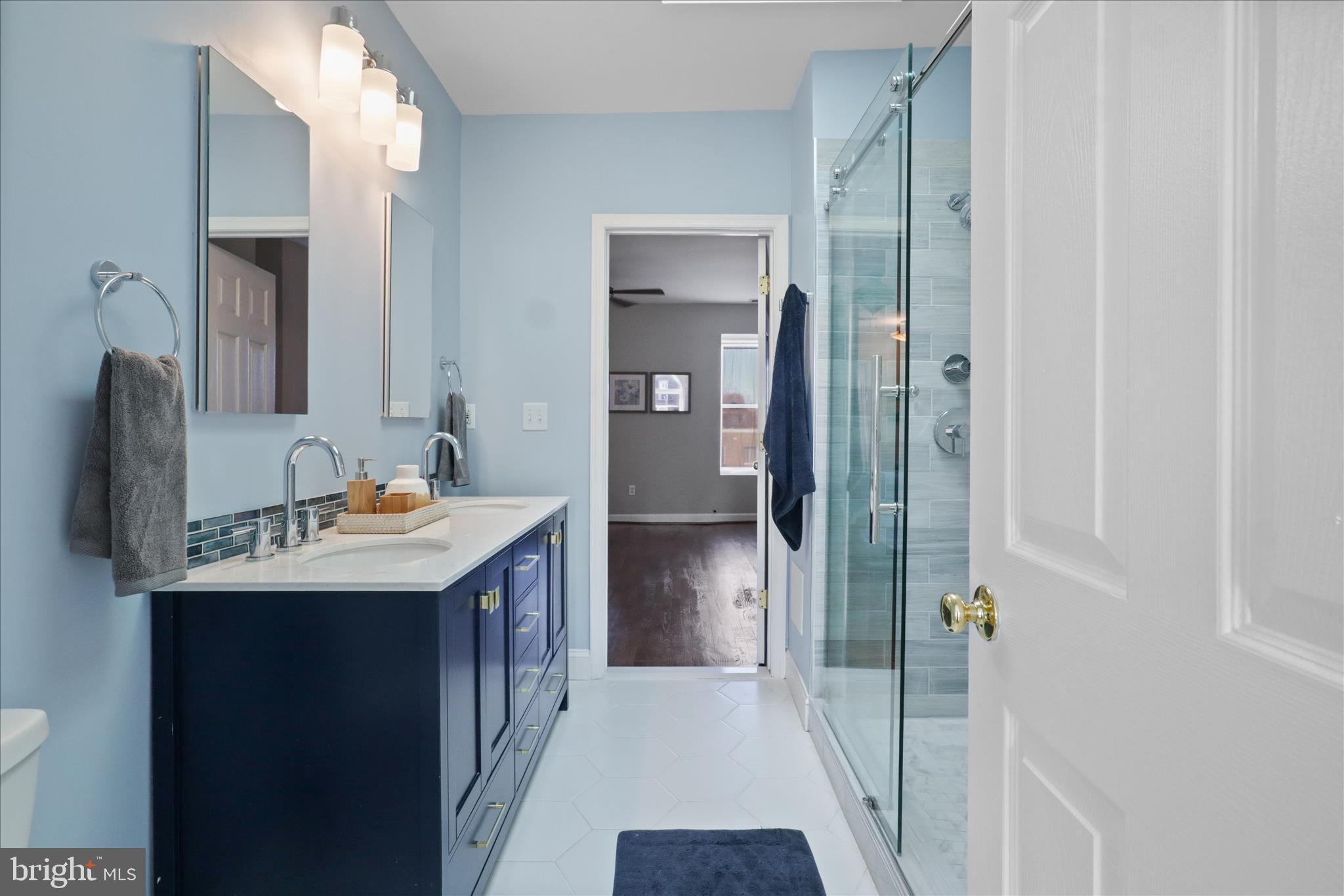 1327 Harvard Street Northwest Washington, DC 20009 - Photo 37 of 61 a bathroom with a sink and mirror