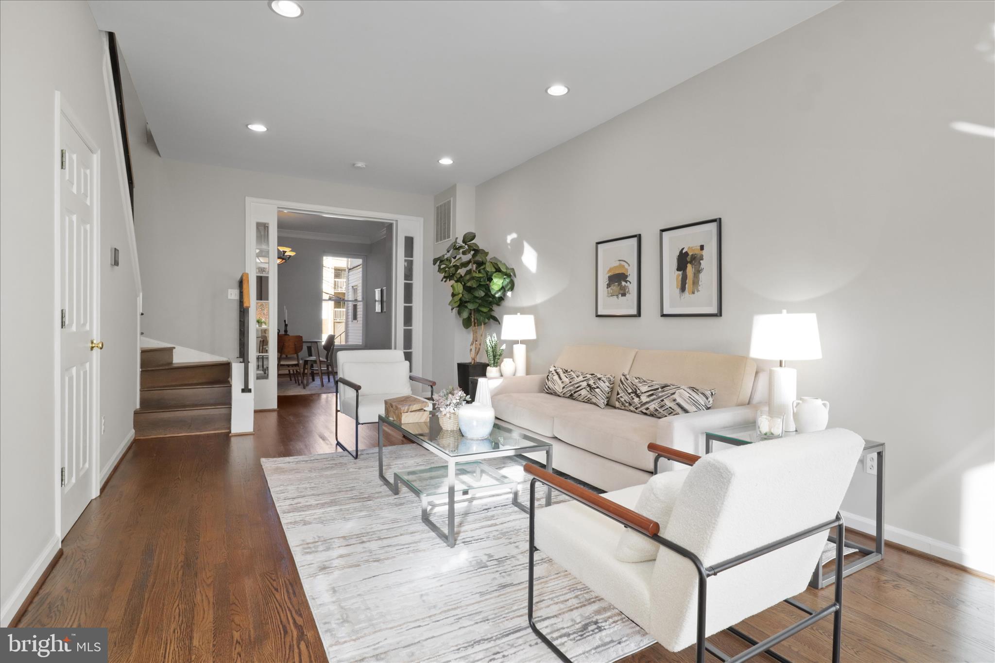 1327 Harvard Street Northwest Washington, DC 20009 - Photo 6 of 61 a living room with furniture and a wooden floor