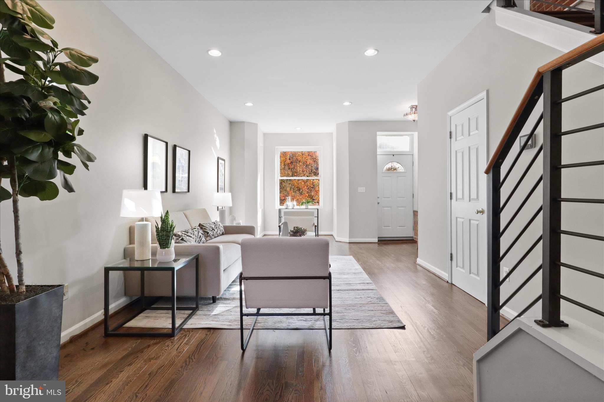 1327 Harvard Street Northwest Washington, DC 20009 - Photo 8 of 61 a living room with furniture and a wooden floor