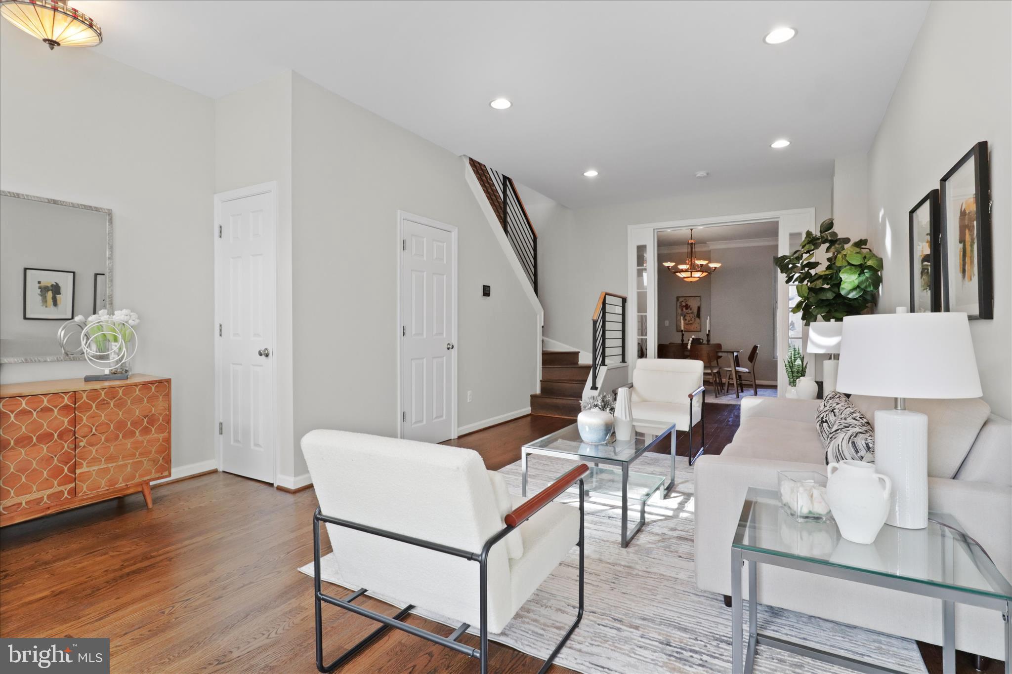 1327 Harvard Street Northwest Washington, DC 20009 - Photo 9 of 61 a living room with furniture and a wooden floor