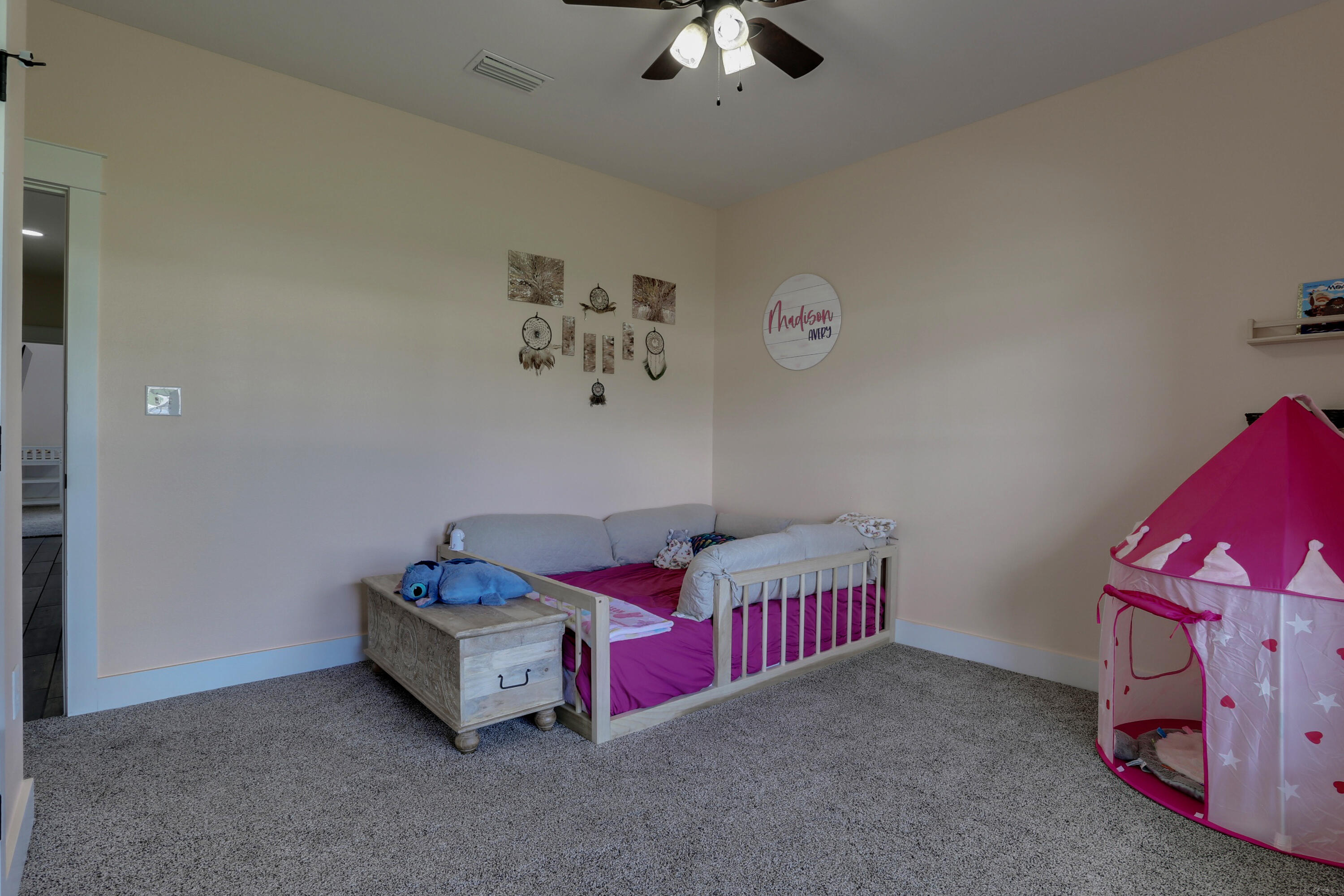 4072 Happy Trails Road Crestview, FL 32539 - Photo 54 of 73 a living room with furniture and a baby crib