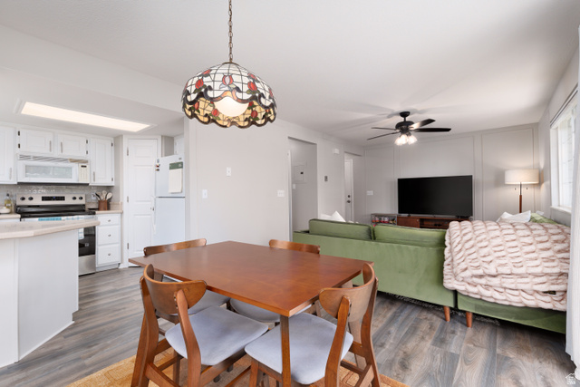 260 400 North, Unit 1 Orem, UT 84057 - Photo 12 of 17 Dining area featuring dark wood-style flooring and ceiling fan