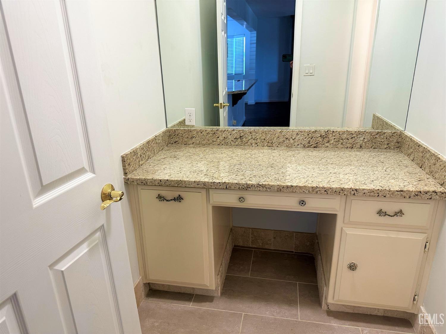 Undisclosed Address Bakersfield, CA 93306 - Photo 11 of 24 a bathroom with a granite countertop sink and a mirror