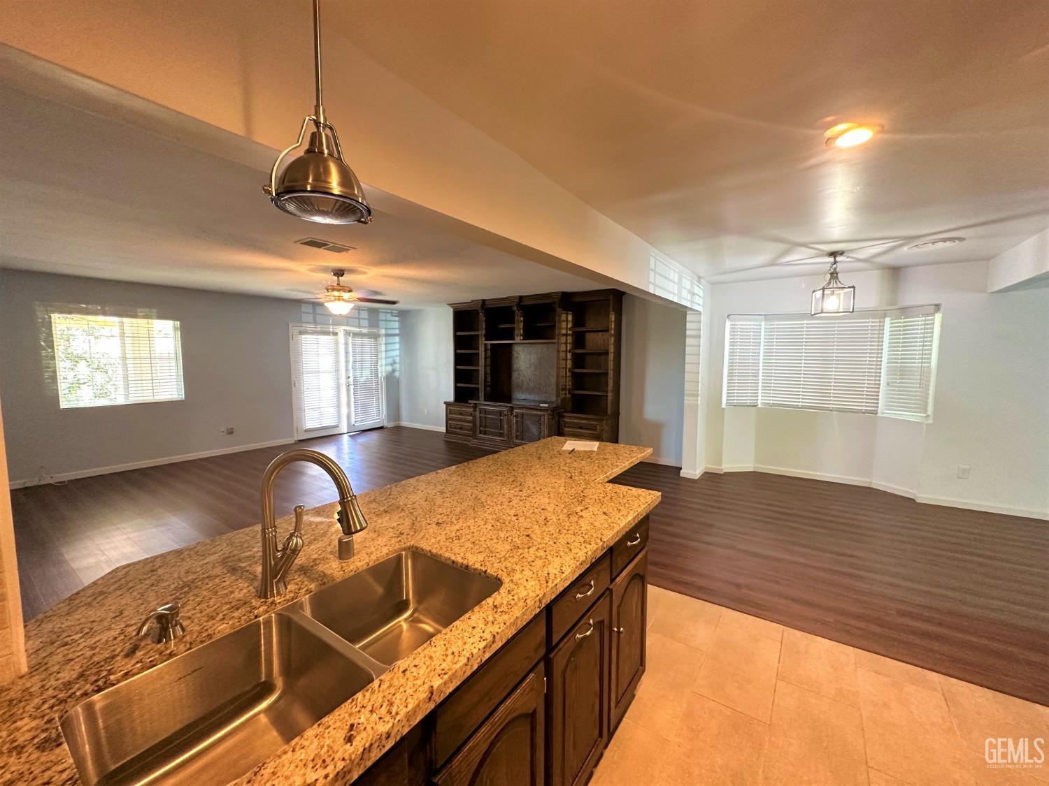 Undisclosed Address Bakersfield, CA 93306 - Photo 13 of 24 a view of a kitchen with a sink and chandelier