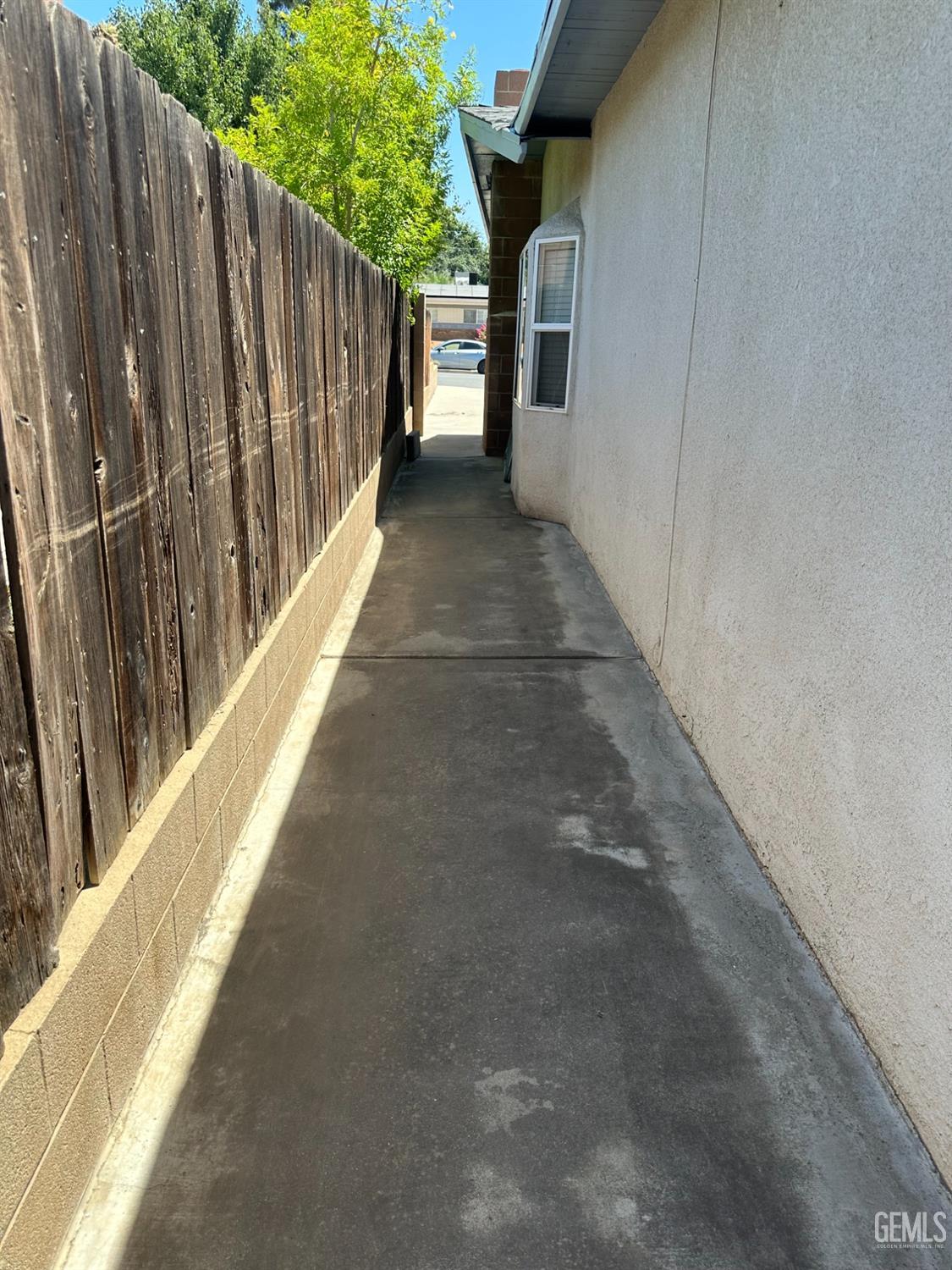 Undisclosed Address Bakersfield, CA 93306 - Photo 20 of 24 a view of a pathway of a house with wooden fence