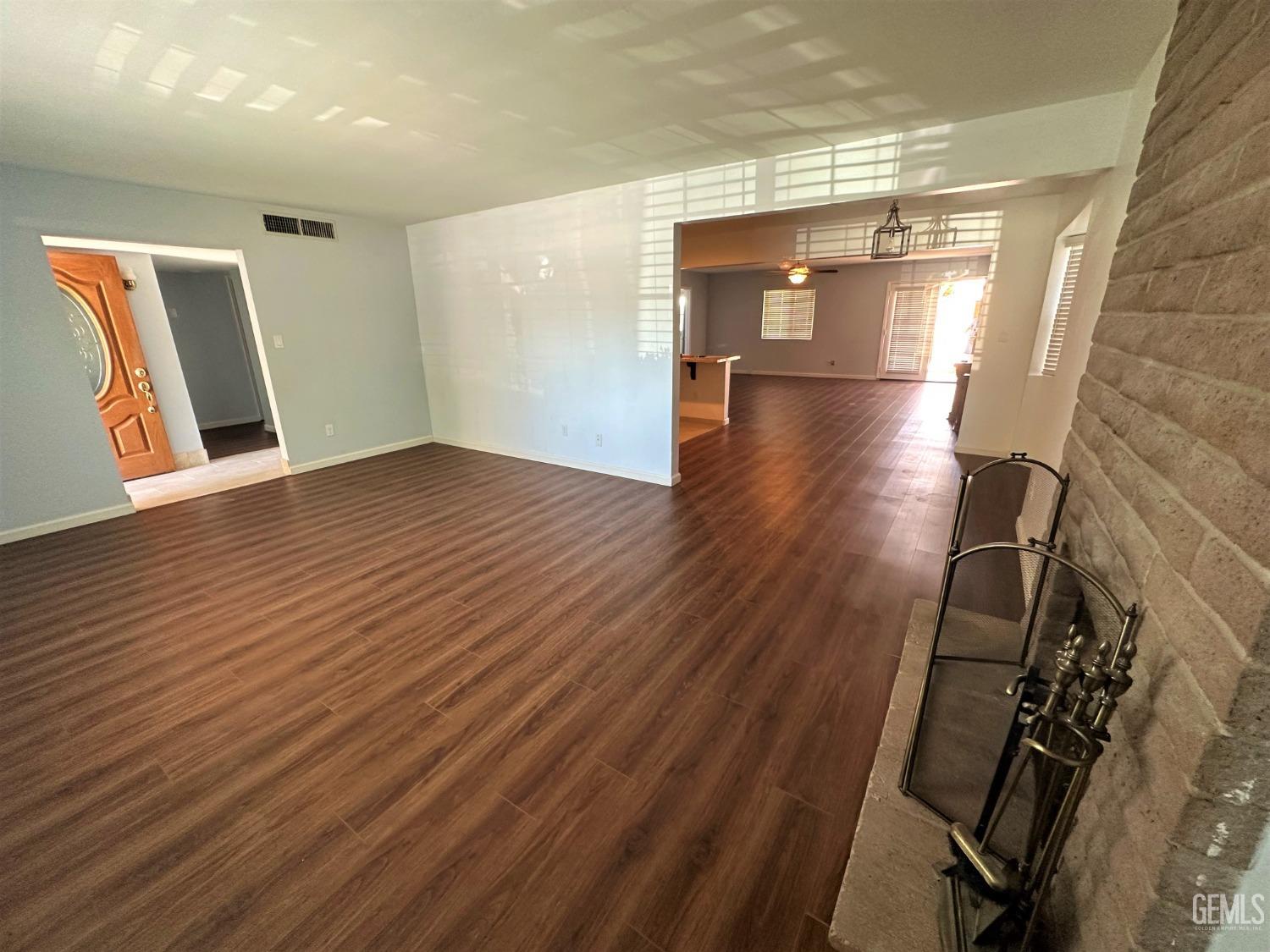 Undisclosed Address Bakersfield, CA 93306 - Photo 5 of 24 a view of empty room with wooden floor