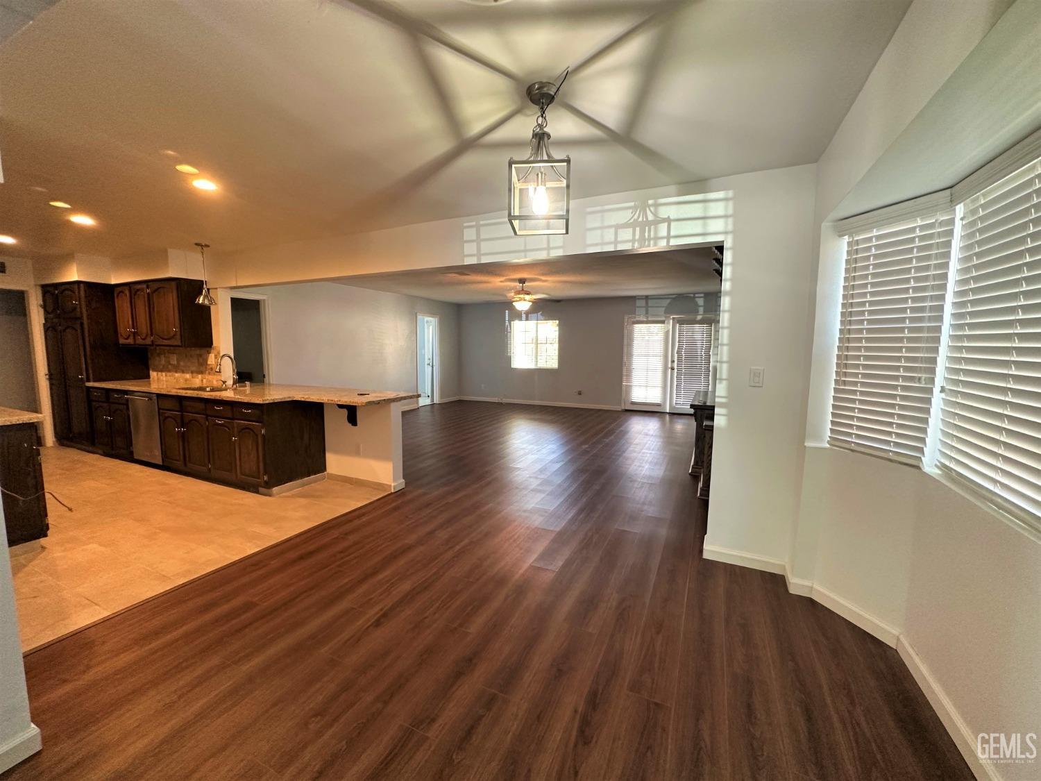 Undisclosed Address Bakersfield, CA 93306 - Photo 6 of 24 a view of kitchen with furniture and wooden floor