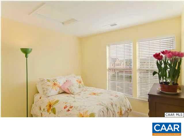 337 Rolkin Road Charlottesville, VA 22911 - Photo 15 of 18 a bedroom with a bed and a window