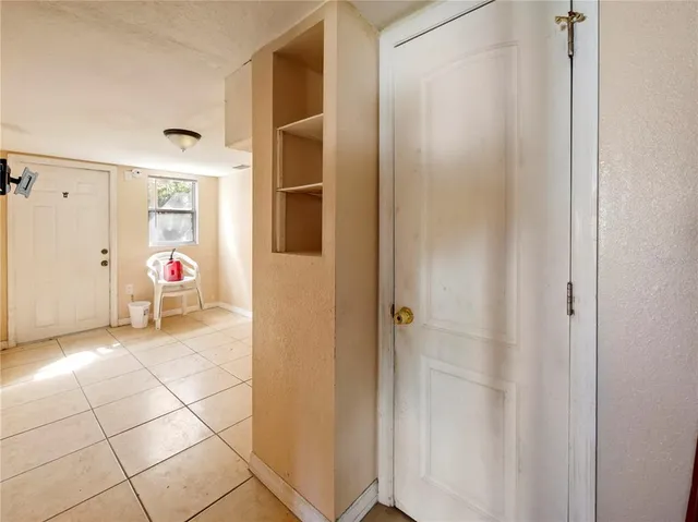 a view of a livingroom with table and chair