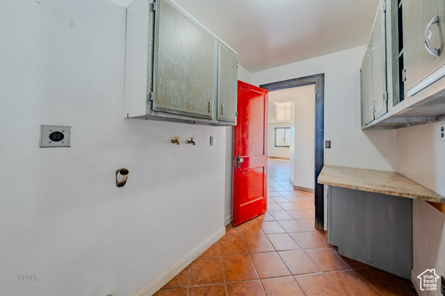 6178 East Zion Road Kanab, UT 84741 - Photo 20 of 48 Laundry room with hookup for an electric dryer, light tile patterned floors, cabinet space, and washer hookup