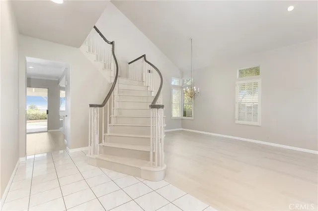 a view of an entryway with wooden floor and windows