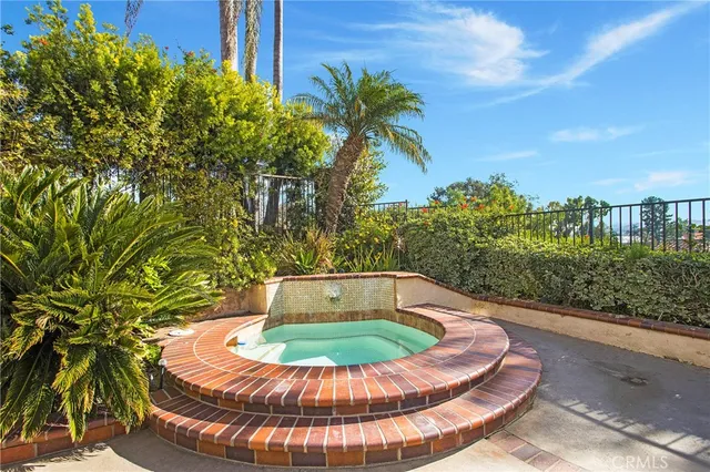 a view of a swimming pool with sitting area