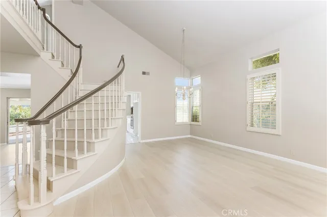 a view of an entryway with wooden floor