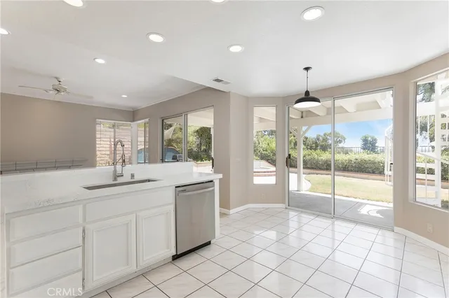 a kitchen with sink and window