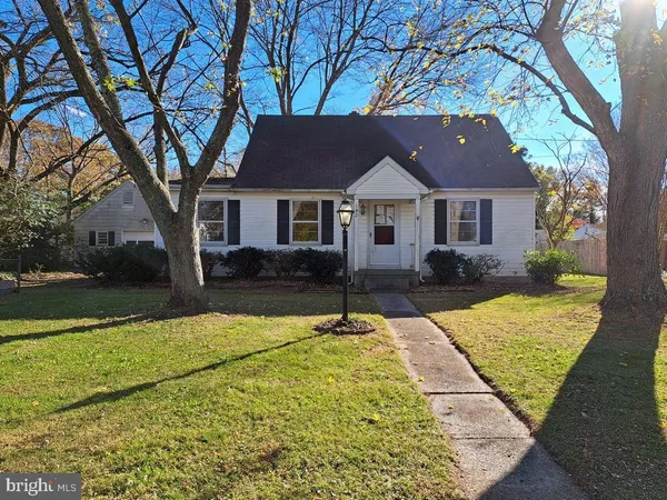 a house with trees in the background