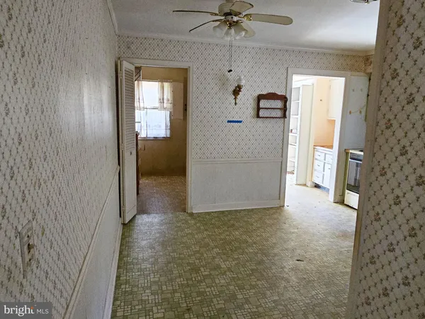a view of a hallway view with wooden floor and staircase