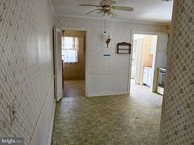 a view of a hallway view with wooden floor and staircase