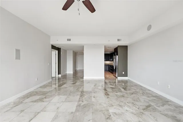 a bathroom with a granite countertop bathtub shower sink double and mirror
