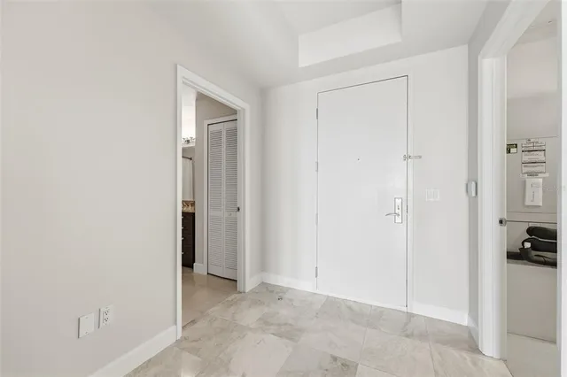 a bathroom with a granite countertop sink a toilet and a mirror